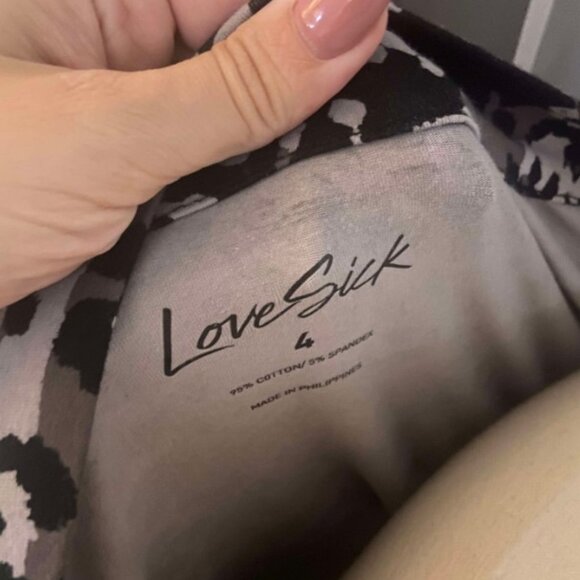 Torrid size 4LoveSick Cold Shoulder Keyhole Tee - Super Soft Black Hiding Skulls - Picture 10 of 10